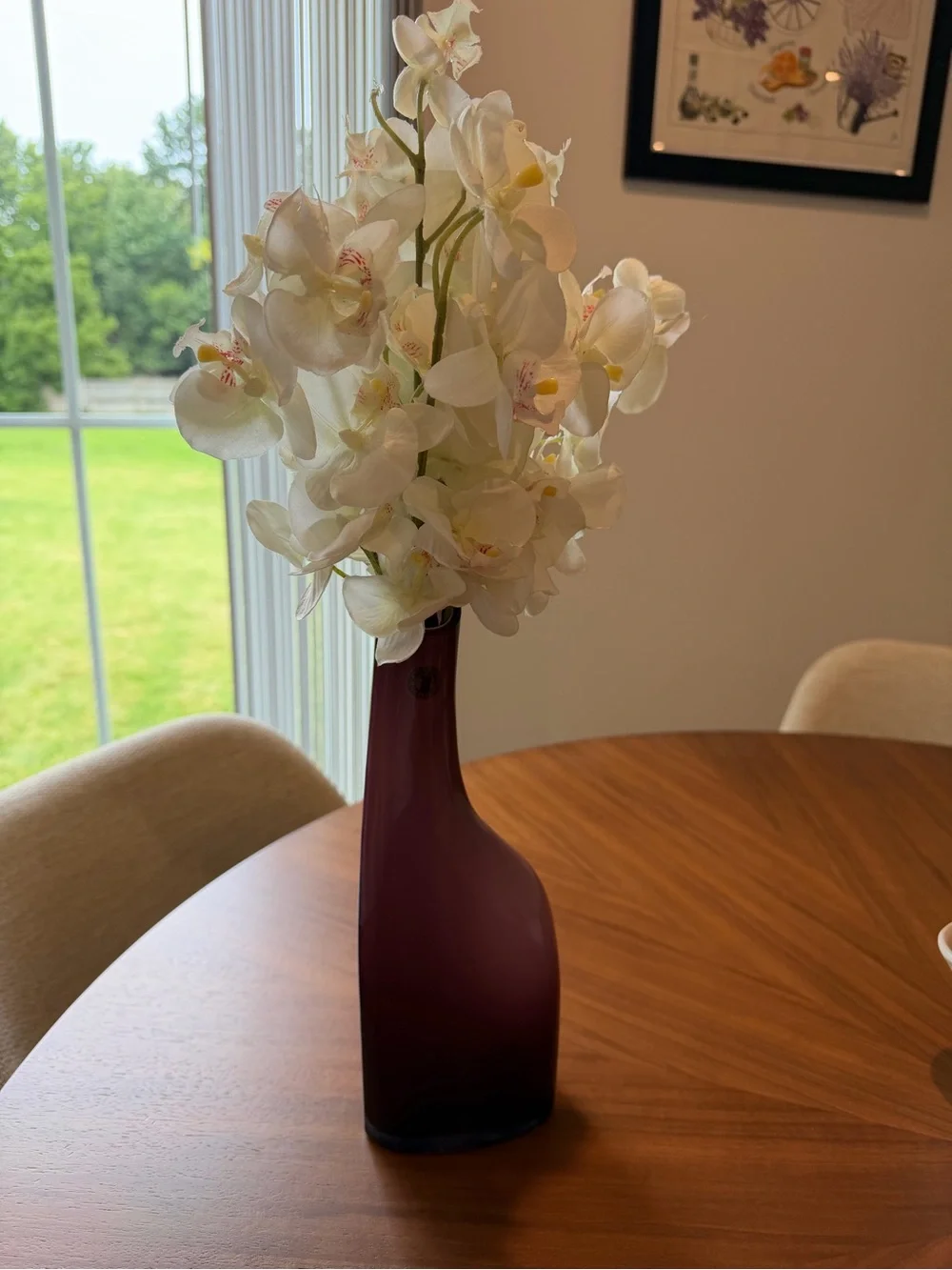Purple IKEA vase with faux orchids